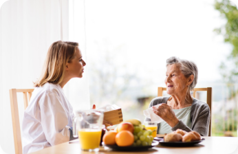 Health advisor and a senior woman during home visit